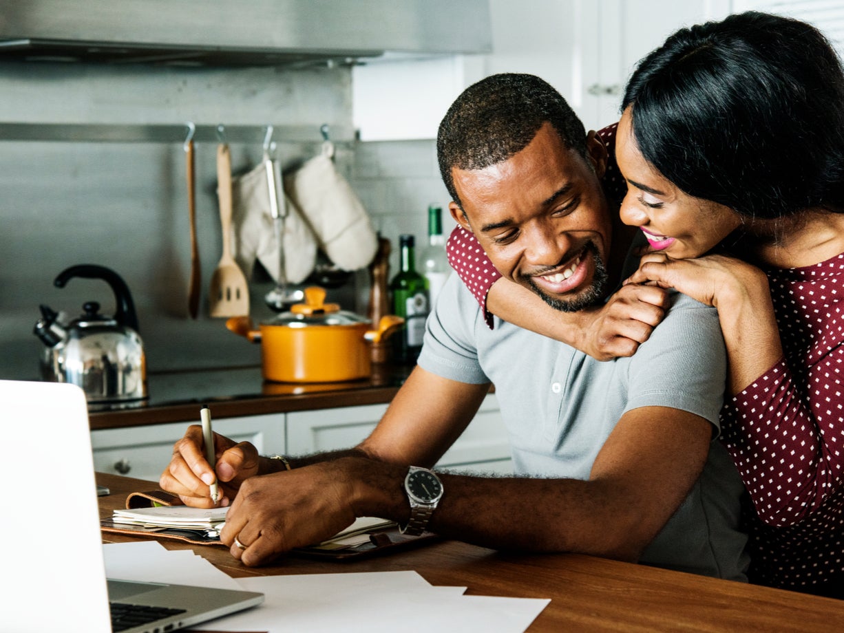 Two people talking in a kitchen